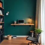a desk with a computer and a chair in a room